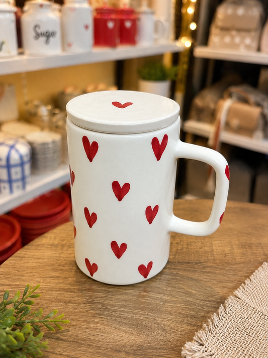 White ceramic mug with red hearts and lid