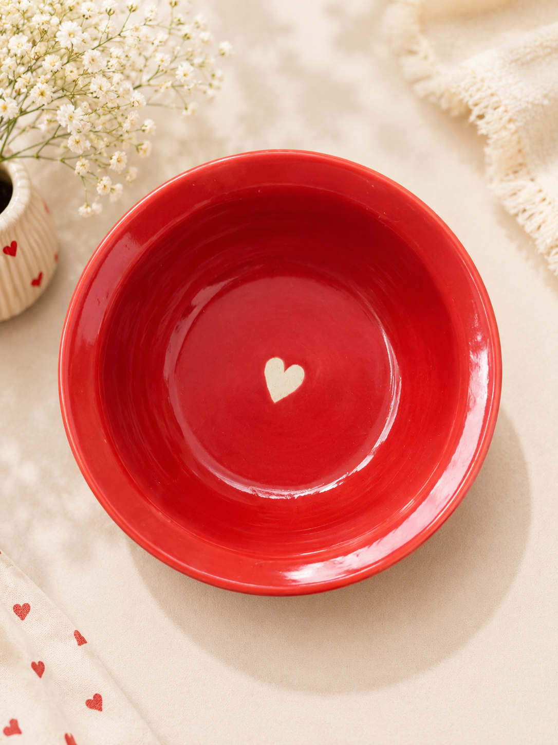 Red ceramic bowl with cream heart